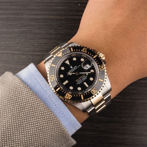 rolex sea dweller with gold hands in stainless